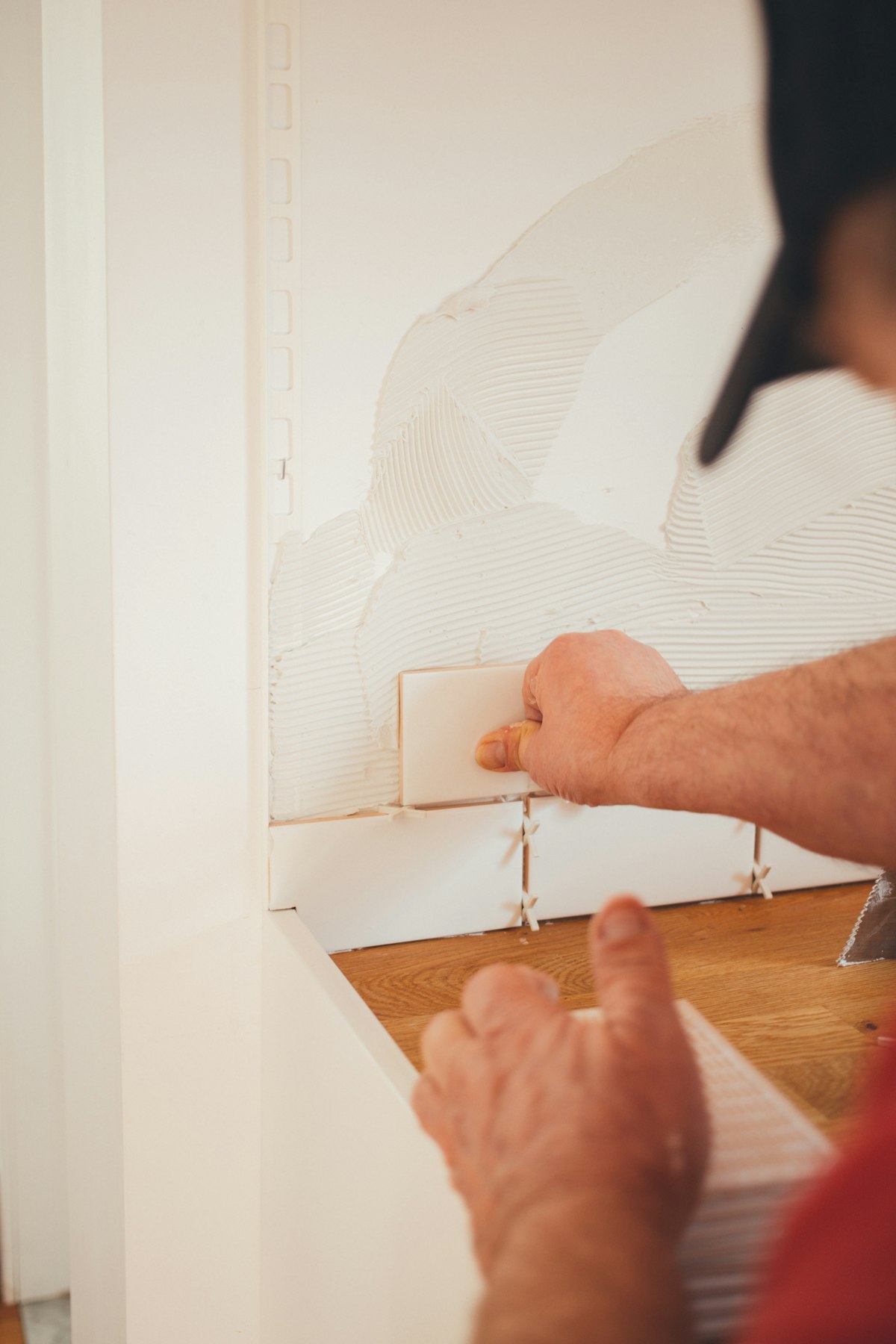 Buddy Tile installer setting large-format tile